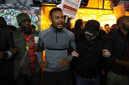 Anti-racism protesters lock arms outside the Vaults in London in opposition to ‘Exhibit B’. 23 September 2014. Photograph: © Thabo Jaiyesimi.